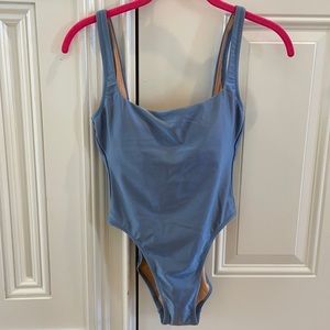 Shiny blue one piece bathing suit